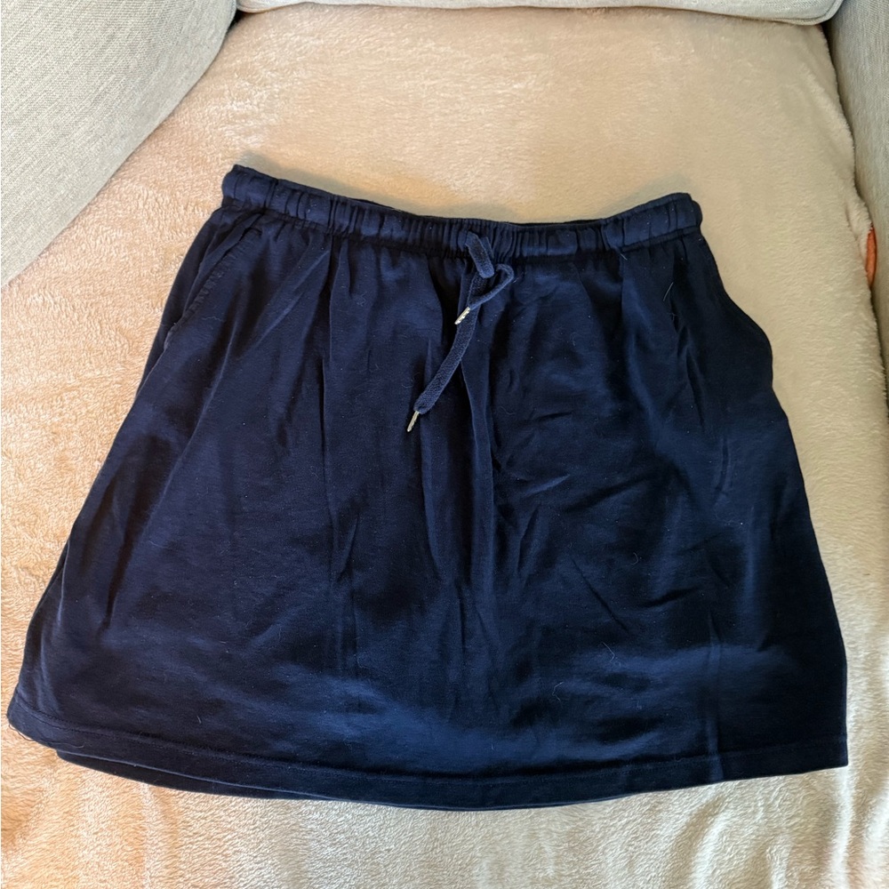 Woman Within Dark Blue Mini Skirt